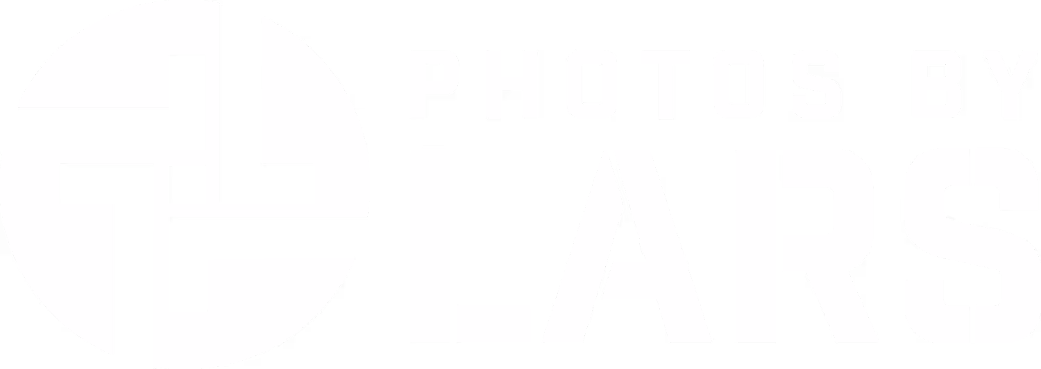 White "Photos by Lars" logo featuring a stylized geometric camera shutter icon and bold, block lettering on a black background, representing a photography service.