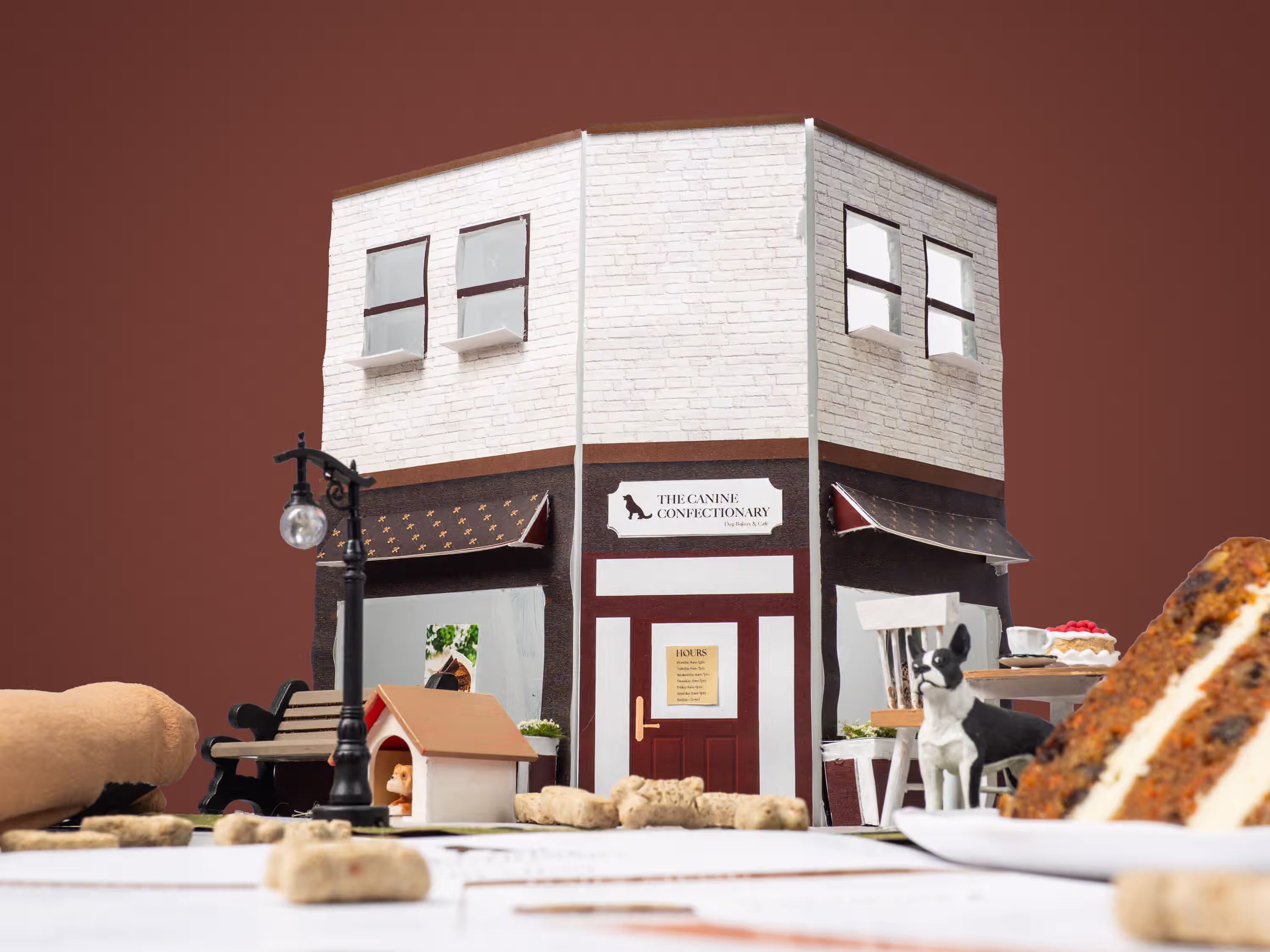 Miniature storefront set built for The Canine Confectionary dog bakery product photography with styled treats and props
